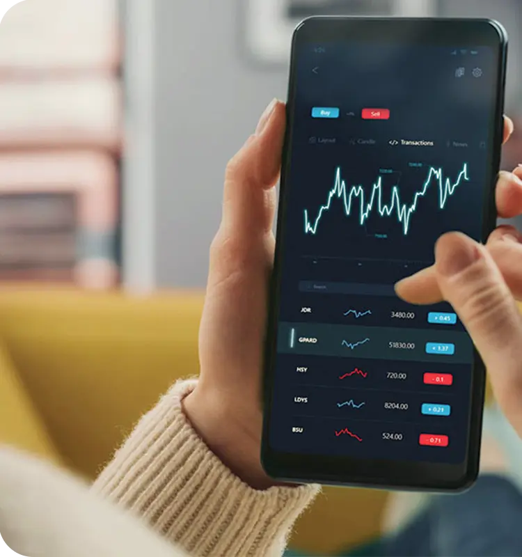 A person holding a phone that shows the financial market fluctuations.